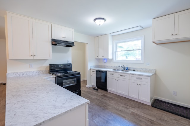 kitchen with sink, light hardwood / wood-style flooring, white cabinetry, and black appliances