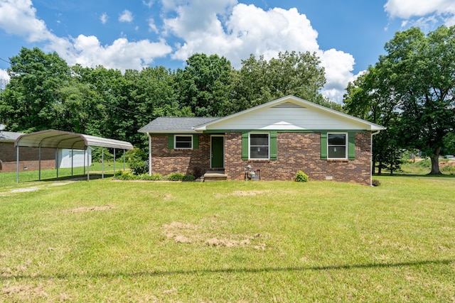 view of front facade with a front lawn and a carport