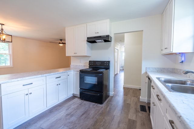 kitchen with white cabinetry and black / electric stove