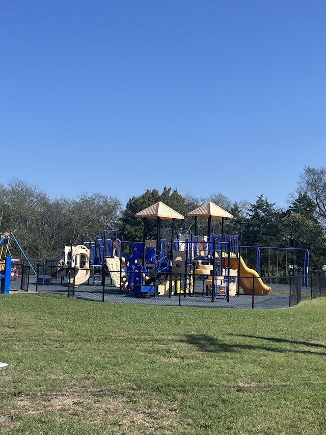 view of jungle gym featuring a yard