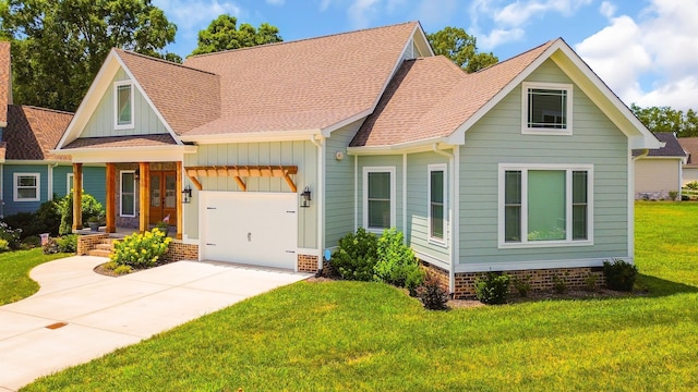 view of front facade featuring a garage and a front yard