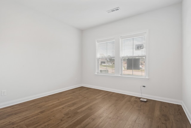 empty room featuring hardwood / wood-style flooring