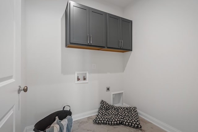 laundry room with cabinets, hookup for a washing machine, and electric dryer hookup