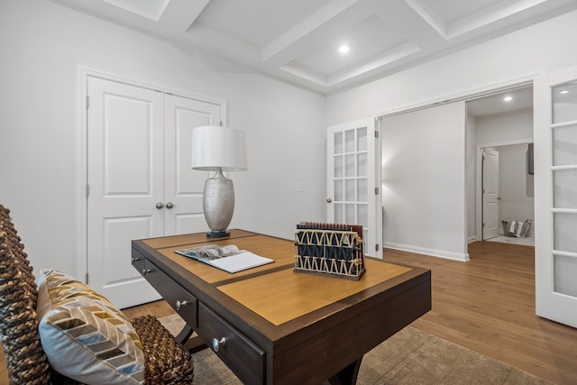 office space featuring beamed ceiling, wood-type flooring, french doors, and coffered ceiling