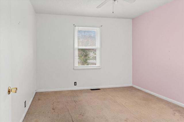 empty room with light carpet and ceiling fan