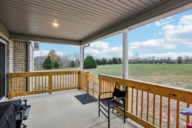 wooden terrace with area for grilling