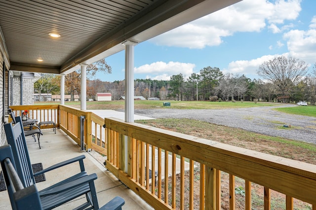 wooden deck featuring covered porch