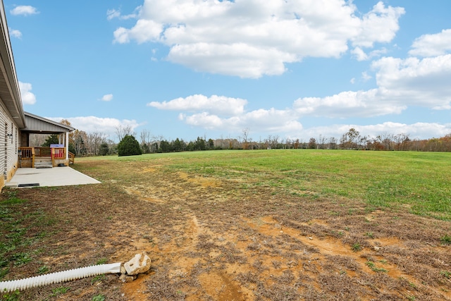 view of yard with a patio area and a rural view