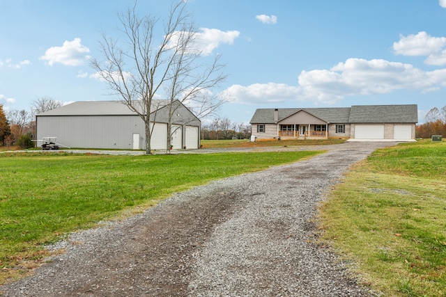 view of front of house with a garage and a front lawn