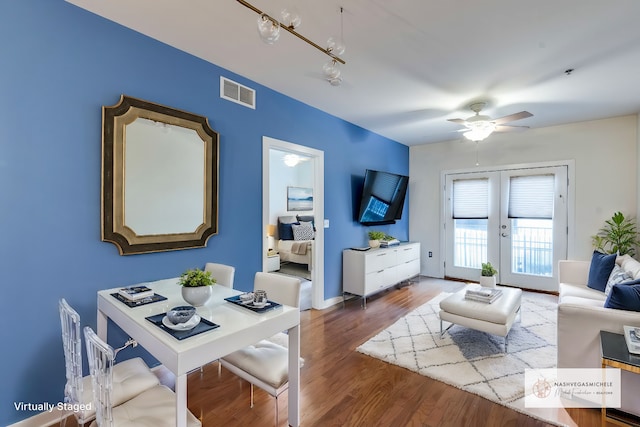 living room with ceiling fan, french doors, and hardwood / wood-style floors