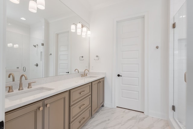 bathroom with a shower with door and vanity