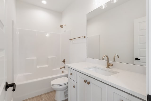 full bathroom featuring tile patterned floors, shower / washtub combination, vanity, and toilet