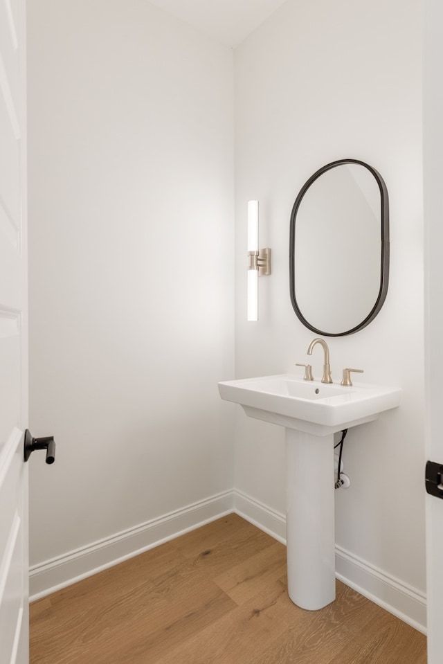 bathroom with wood-type flooring