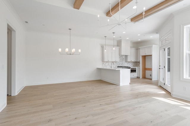 unfurnished living room featuring beam ceiling, light wood-type flooring, and ornamental molding