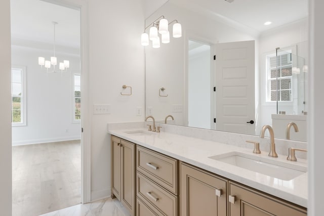 bathroom featuring hardwood / wood-style floors, vanity, and an inviting chandelier