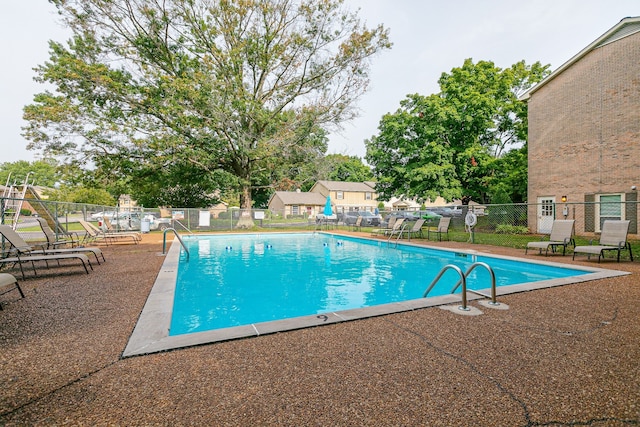 view of pool featuring a patio