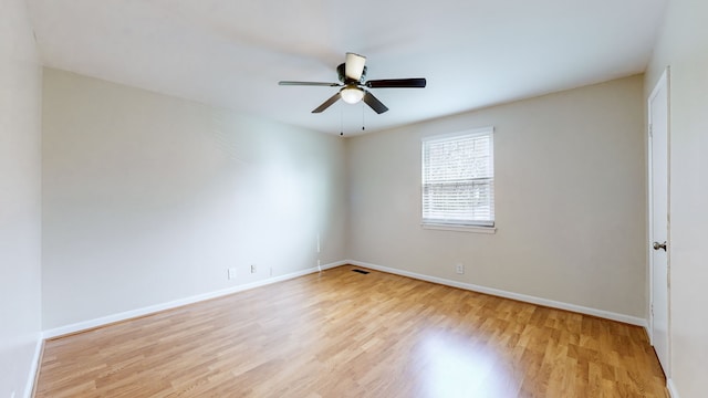 unfurnished room featuring ceiling fan and light hardwood / wood-style floors