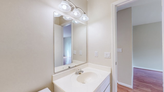 bathroom featuring vanity and wood-type flooring