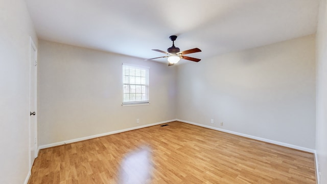 unfurnished room featuring ceiling fan and light hardwood / wood-style floors