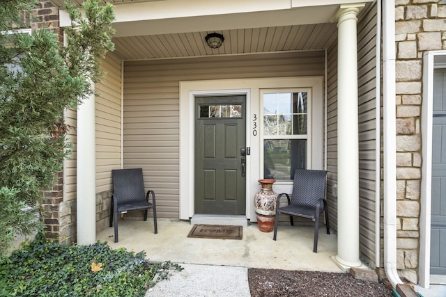 entrance to property featuring a porch