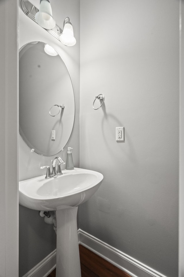 bathroom with wood-type flooring