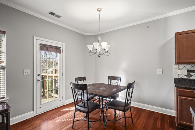 dining room featuring crown molding and dark wood-type flooring