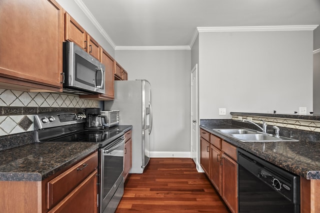 kitchen featuring dark stone counters, sink, decorative backsplash, appliances with stainless steel finishes, and dark hardwood / wood-style flooring