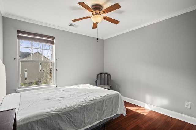 bedroom with ceiling fan, wood-type flooring, and ornamental molding