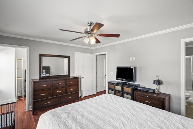 bedroom featuring ornamental molding, ensuite bathroom, ceiling fan, and dark wood-type flooring