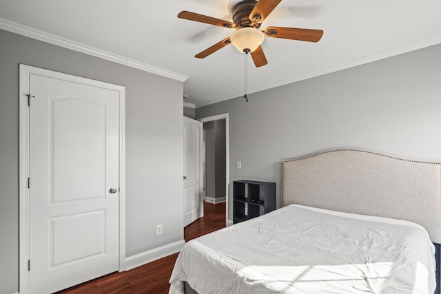 bedroom with dark wood-type flooring, ceiling fan, and crown molding