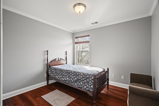 bedroom with ornamental molding and hardwood / wood-style flooring