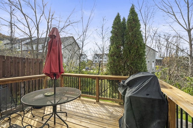 wooden deck featuring area for grilling