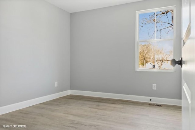 spare room with light hardwood / wood-style floors