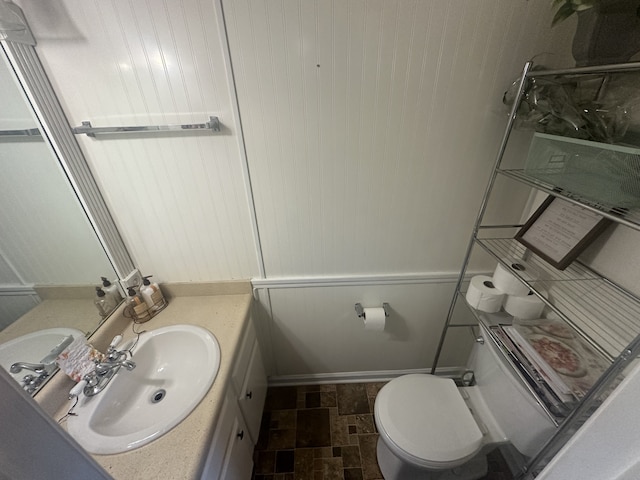 bathroom with vanity and toilet