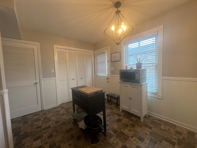 home office featuring a chandelier