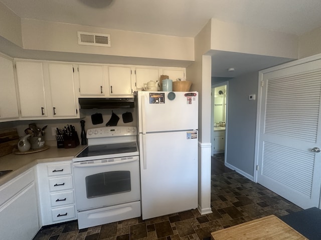 kitchen featuring white cabinetry and white appliances