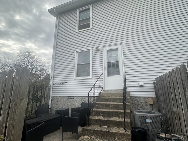 doorway to property with central AC unit