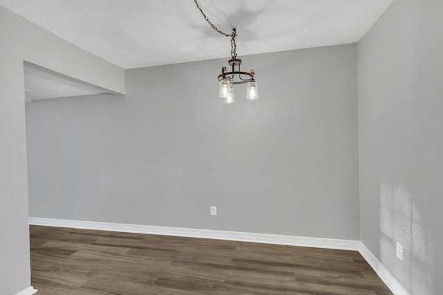 unfurnished dining area featuring wood-type flooring