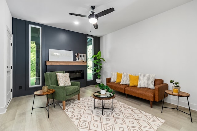 interior space with ceiling fan, light wood-type flooring, and a wealth of natural light