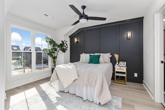 bedroom featuring ceiling fan and light hardwood / wood-style flooring