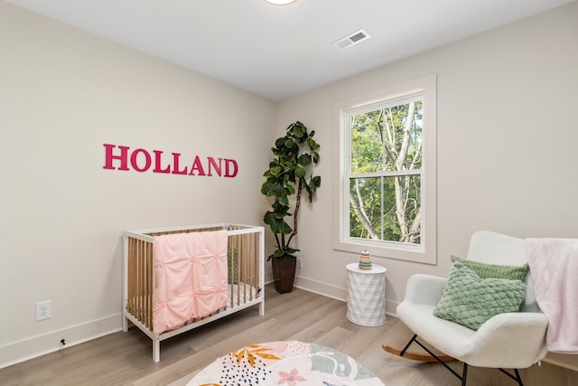 sitting room featuring hardwood / wood-style flooring