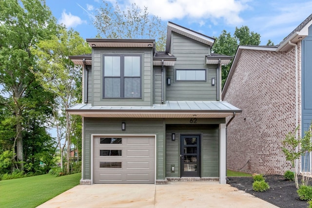 view of front facade with a front yard and a garage