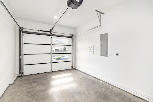 garage with electric panel and a garage door opener