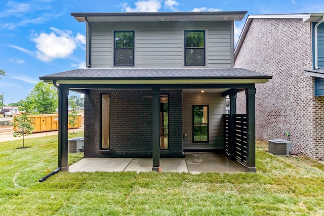 rear view of house with central AC