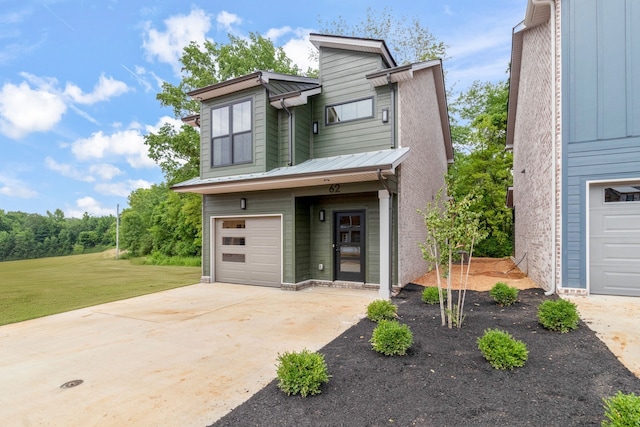 view of front of home with a garage and a front yard