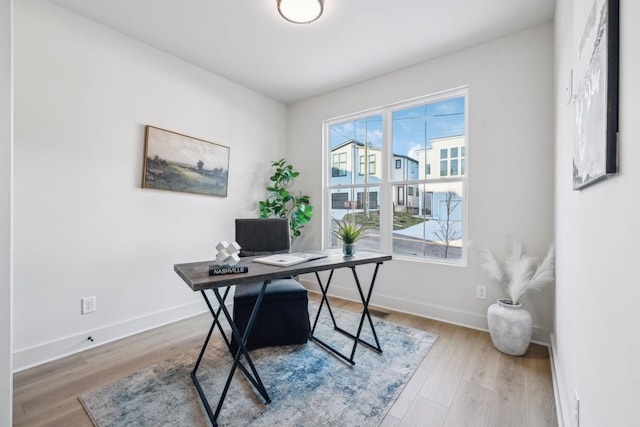 office with hardwood / wood-style flooring