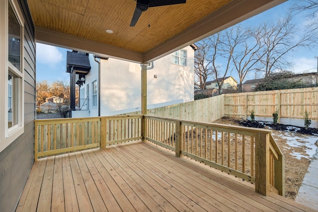 wooden deck featuring ceiling fan