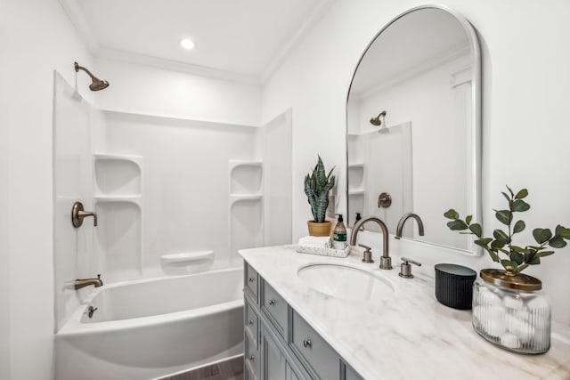 bathroom featuring wood-type flooring, vanity, bathing tub / shower combination, and crown molding