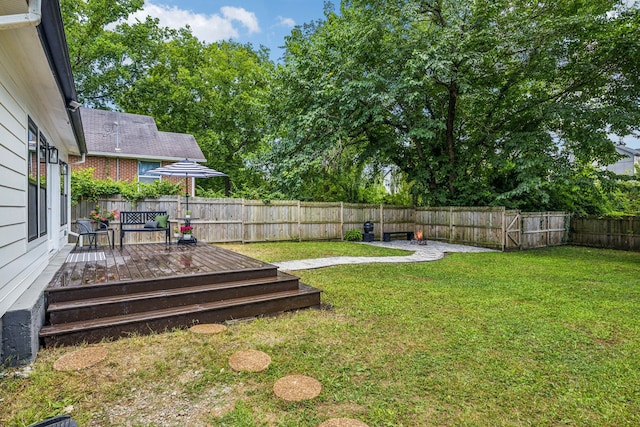 view of yard featuring a wooden deck