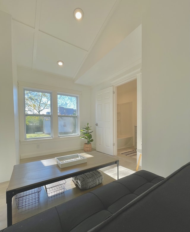 unfurnished living room with lofted ceiling